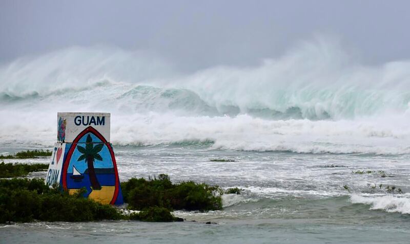 High waves from Typhoon Mawar batter the coast of Ipan in Talofofo, Guam, on May 24, 2023.