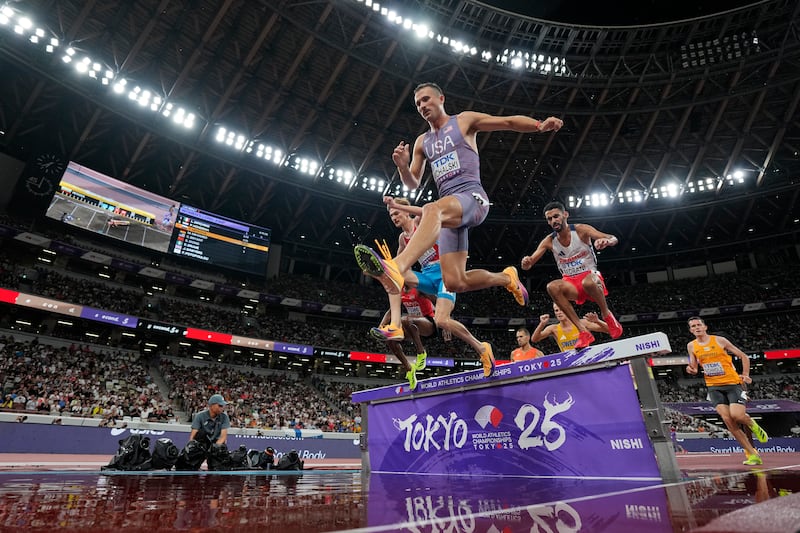 United States' Daniel Michalski, center, Luxembourg's Ruben Querinjean, left, and France's Djilali Bedrani, right, compete in a men's 3,000 meters steeplechase heat at the World Athletics Championships in Tokyo, Saturday, Sept. 13, 2025.