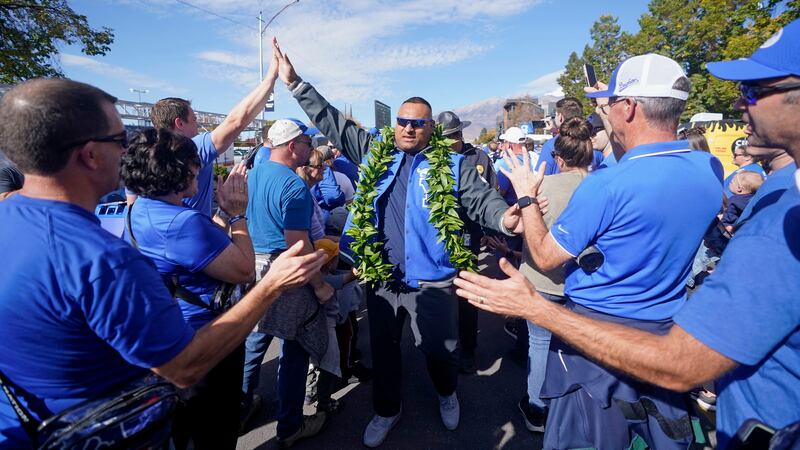 BYU head coach Kalani Sitake greets fans before the start of their NCAA college football game against Texas Tech Saturday, Oct. 21, 2023, in Provo, Utah. (AP Photo/Rick Bowmer)