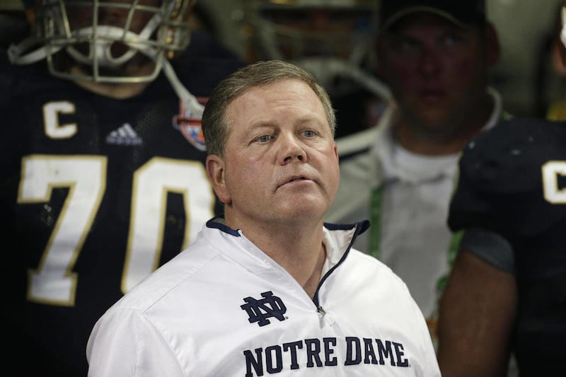 FILE - Notre Dame head coach Brian Kelly watches play against Alabama during the second half of the BCS National Championship college football game in this Jan. 7, 2013 file photo taken in Miami. The Philadelphia Eagles interviewed Notre Dame coach Brian