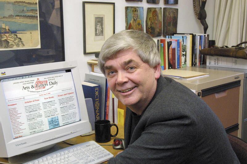 In this Aug. 3, 2002 photo, Dr. Dennis Dutton poses at a computer in his office at the University of Canterbury. Author, academic and founder of the popular Arts & Letters Daily website Denis Dutton died in New Zealand, Tuesday, Dec, 2010 at the age of 6