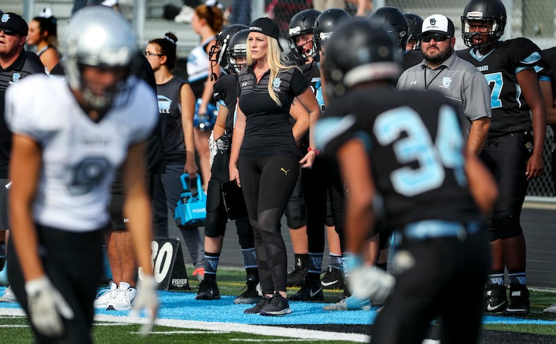 West Jordan assistant football coach Stephanie Davis watches her defensive unit play during the West Jordan-Riverton sophomore game at West Jordan High on Wednesday, Sept. 12, 2018. Davis is the only female football coach in the state. She is the defensiv