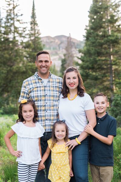 Corey Holmgren with his wife, Mindi Holmgren, and their children.