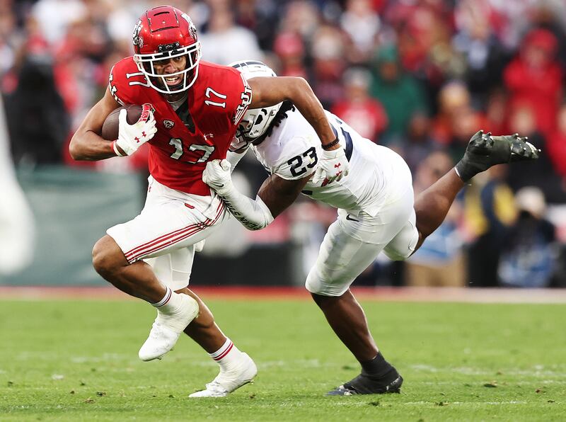 Utah receiver Devaughn Vele battles for yards during Rose Bowl game against Penn State in Pasadena, California.