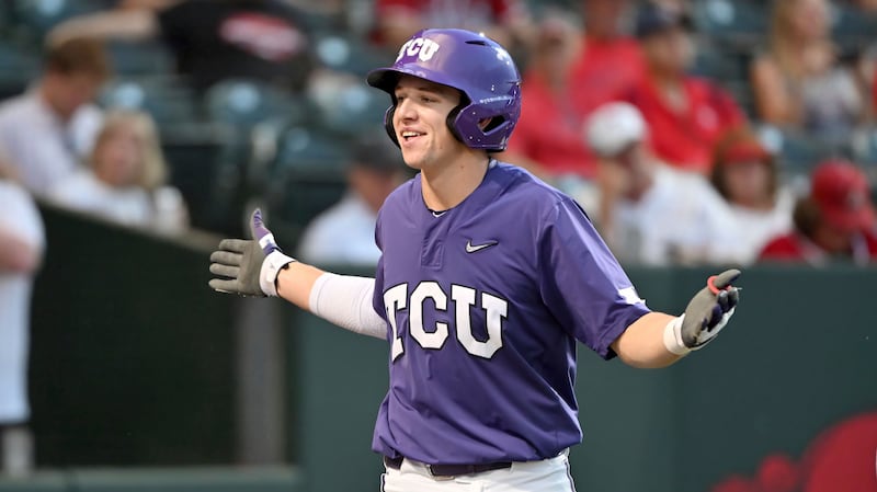 TCU batter Brayden Taylor holds his arms out