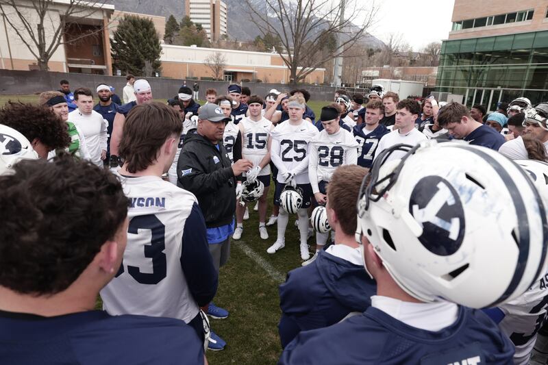 BYU coach Kalani Sitake talks to the team