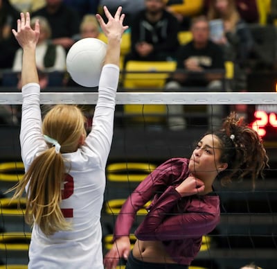 Lone Peak's Tasia Farmer, right, rips a shot into Northridge's Brighton Williams during the high school volleyball 6A state tournament at UVUU in Orem on Thursday, Nov. 1, 201