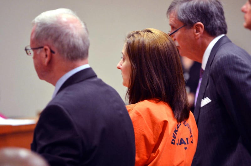 Andrea Sneiderman listens as her sentence is handed down by Judge Adams during her sentencing hearing Tuesday, Aug. 20, 2013 in Decatur, Ga.