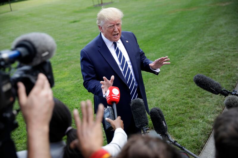 President Donald Trump speaks to members of the media before boarding Marine One helicopter on the South Lawn of the White House in Washington, for the short flight to nearby Andrews Air Force Base, Md., Friday, July 19, 2019. Just over a third of Utahns