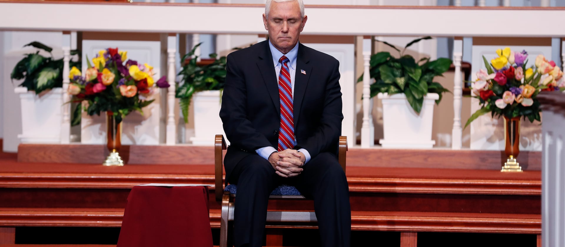 Vice President Mike Pence bows his head in prayer during a discussion with local faith leaders to encourage them to resume in-person church services in a responsible fashion in response to the coronavirus pandemic, Friday, May 8, 2020, in Urbandale, Iowa.