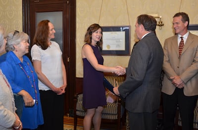 Utah poet laureate Paisley Rekdal shakes hands with Utah Gov. Gary R. Herbert. Rekdal received a $100,000 award from the Academy of American Poets.