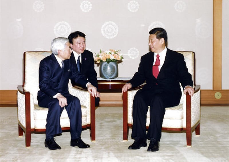 In this photo released by the Imperial Household Agency of Japan, Chinese Vice President Xi Jinping, right, talks with Japanese Emperor Akihito, left, during his audience at Imperial Palace in Tokyo, Japan, Tuesday.