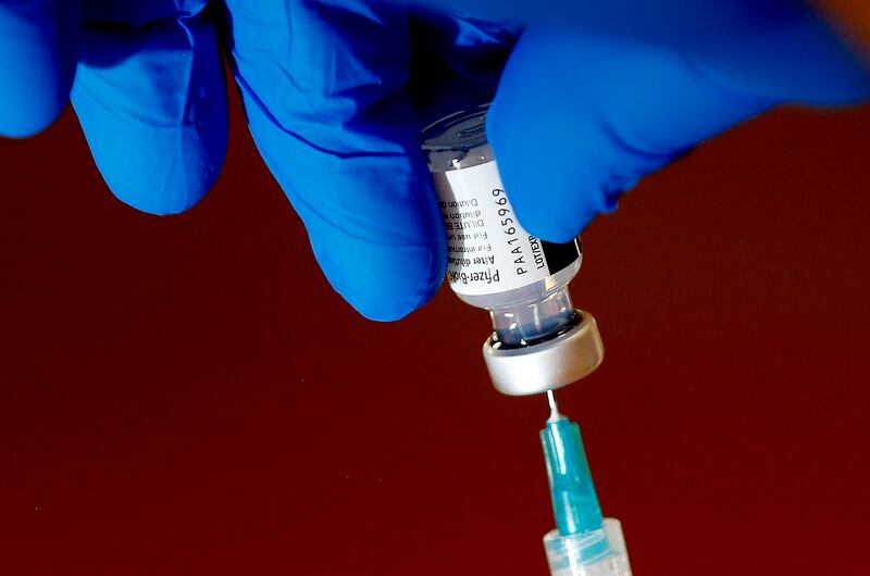 The Pfizer-BioNTech COVID-19 vaccine is drawn into a syringe in Utah.