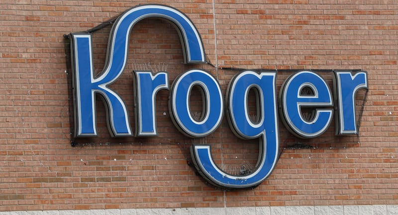 A Kroger grocery store sign sits above the entrance to the building in Flowood, Miss.