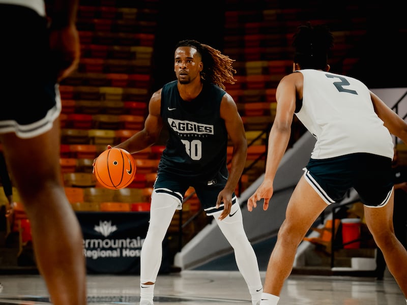 Utah State guard Josh Uduje dribbles at the Smith Spectrum in Logan as the team prepares for the 2023-24 season.