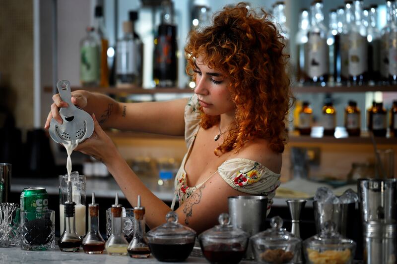 Bartender Lola Hushin, 25, mixes up a non-alcoholic drink Saturday, July 27, 2019. Sam Thonis, 31, and Regina Dellea, 29, opened Getaway, an alcohol-free bar in Brooklyn, New York, on April 9, 2019. The bar serves mixed drinks for $13 as well as some snac