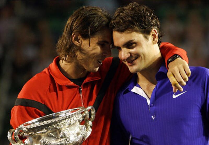 Rafael Nadal, left, hugs Roger Federer after beating him in five sets Sunday.