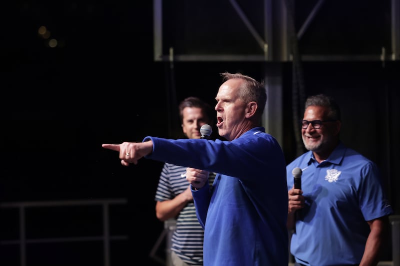 BYU athletic director Tom Holmoe speaks to fans at event held in the early hours Saturday night in Provo.