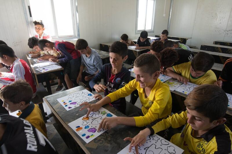 Children at a camp for displaced persons in Iraq take part in a Hardwired Global-sponsored activity.