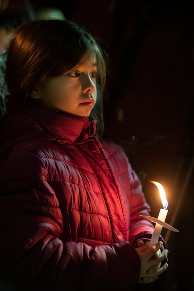 Laila Sanchez holds her candle as she and her family join hundreds who came to pay respects to slain Provo police officer Joseph Shinners at the Provo Police Department on Wednesday, Jan. 9, 2019.