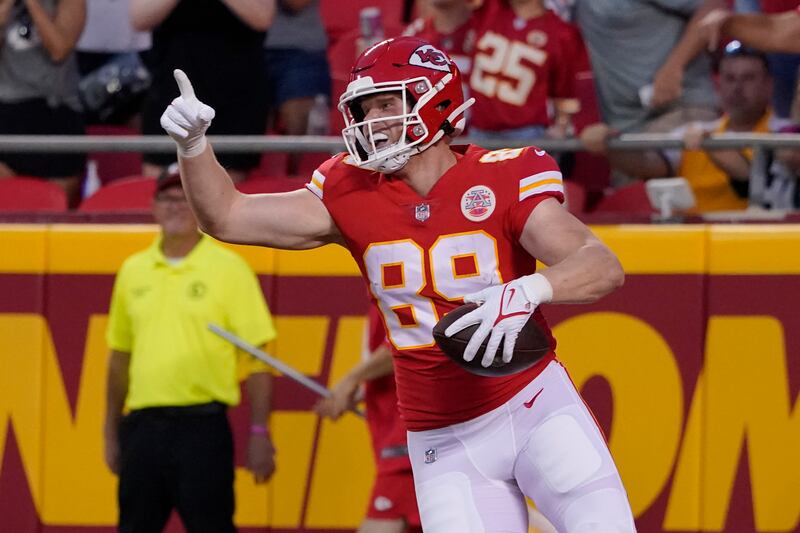 Kansas City Chiefs tight end Matt Bushman celebrates after scoring during the first half of an NFL preseason football game against the Green Bay Packers Thursday, Aug. 25, 2022, in Kansas City, Mo.