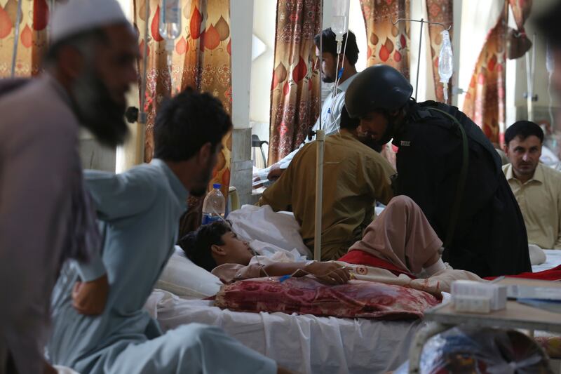 Injured people lie on the bed at a hospital after Sunday’s suicide bomber attack, in the Bajur district of Khyber Pakhtunkhwa, Pakistan.