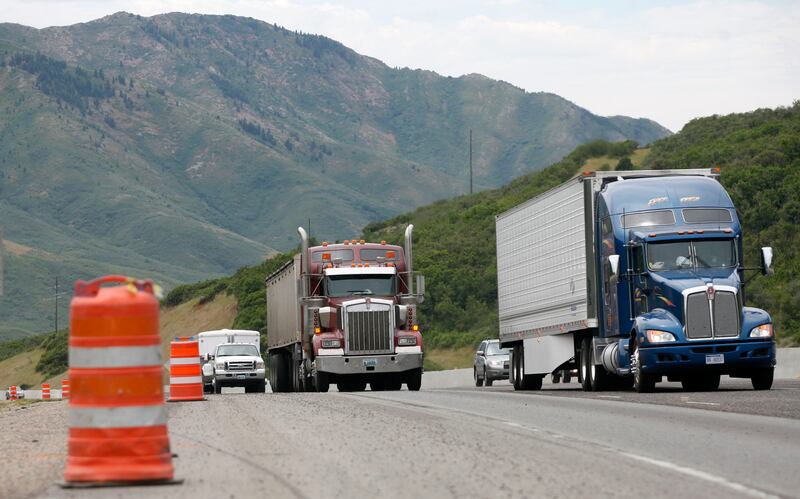 Cars and trucks move through a construction zone in Parleys Canyon on July 19, 2012.