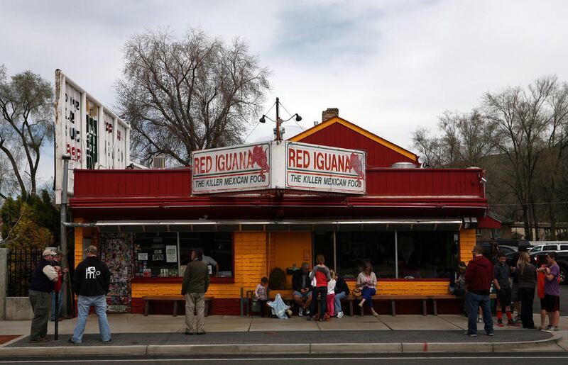 People wait to be seated at Red Iguana on Friday, April 5, 2013.