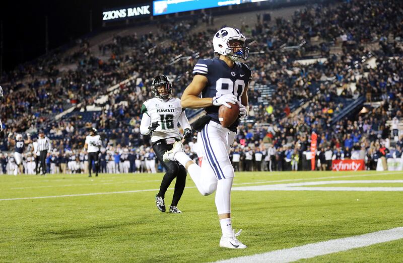 Brigham Young Cougars wide receiver Gunner Romney (80) runs out the back of the end zone after catching a pass for a touchdown as BYU and Hawaii play at LaVell Edwards Stadium in Provo on Saturday, Oct. 13, 2018. BYU won 49-23.