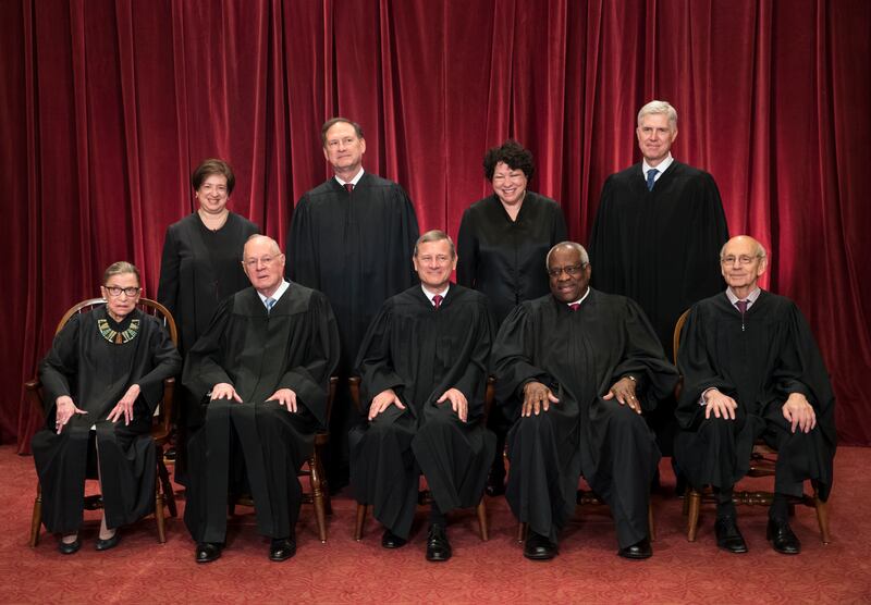 In this June 1, 2017, file photo, the justices of the U.S. Supreme Court gather for an official group portrait to include new Associate Justice Neil Gorsuch, top row, far right at the Supreme Court Building in Washington. Seated, from left are, Associate