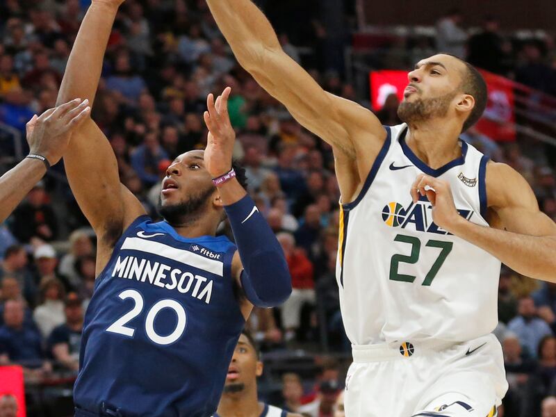 Utah Jazz center Rudy Gobert (27) blocks the shot of Minnesota Timberwolves guard Josh Okogie (20) during the first half of an NBA basketball game Friday, Jan. 25, 2019, in Salt Lake City.