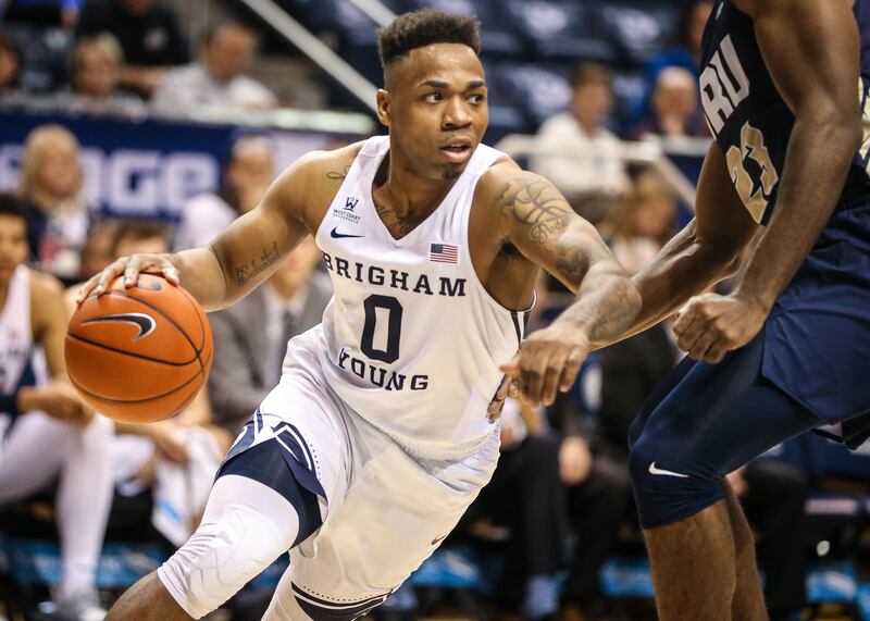Brigham Young Cougars guard Jahshire Hardnett (0) dribbles the ball against Oral Roberts Golden Eagles forward Emmanuel Nzekwesi (23) during a game at Marriott Center in Provo on Thursday, Nov. 15, 2018.