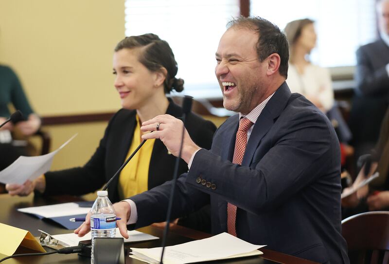 Rep. Mike Schultz, R-Hooper, laughs while speaking about HB443 during hearing at the Capitol in Salt Lake City.