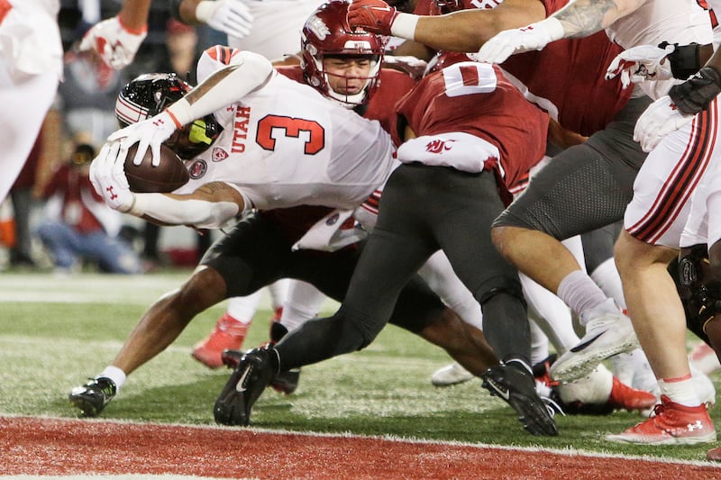 Utah running back Ja’Quinden Jackson (3) reaches for a touchdown during the first half of an NCAA college football game against Washington State, Thursday, Oct. 27, 2022, in Pullman, Wash. (AP Photo/Young Kwak)