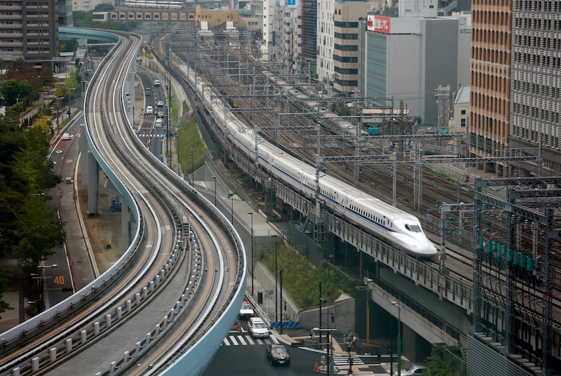 In this Sept. 24, 2014, file photo, a Shinkansen bullet train heads for Tokyo Station on the Tokaido Main Line in Tokyo.