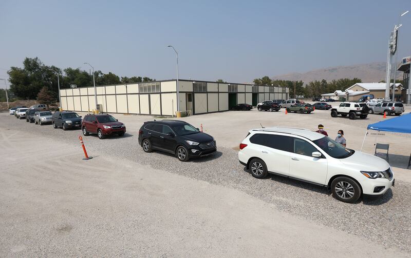 People wait in line for a COVID-19 test.