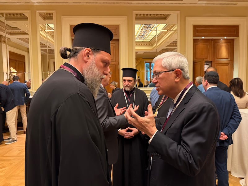 Elder Gerrit W. Gong, right, speaks with His Eminence Metropolitan Gabriel, George Papanicolaou, of the Greek Orthodox Church on May 25, 2026, in Athens, Greece.