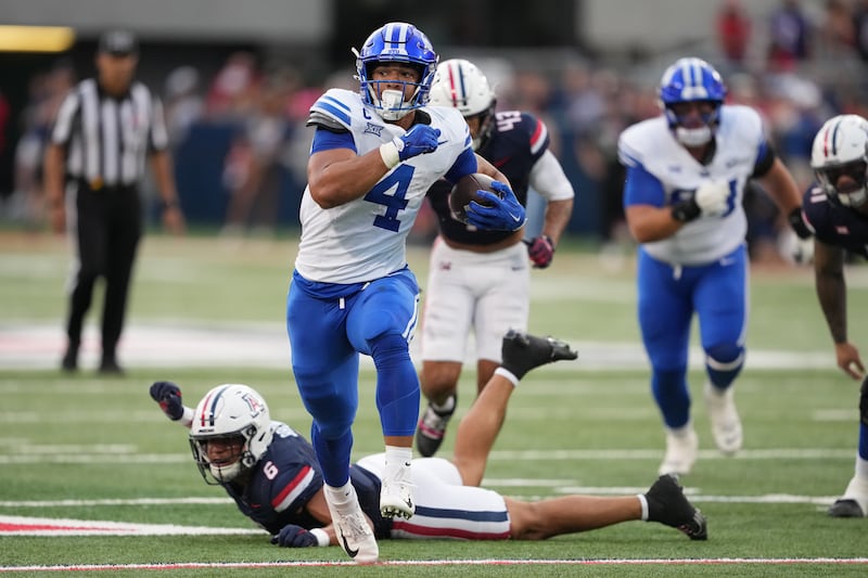 BYU running back LJ Martin (4) runs for a touchdown against Arizona Saturday, Oct. 11, 2025, in Tucson, Ariz.