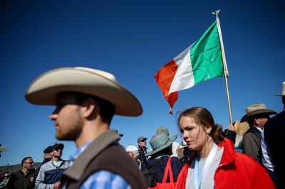 Cowboy hats and an Irish flag are seen in the crowd of people duirng the Spike 150 celebration at Golden Spike National Historic Park at Promontory Summit on Friday, May 10, 2019.