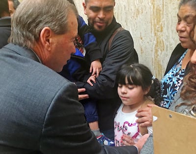 Sen. Tom Udall, D-N.M., left, speaks to immigrant rights advocates at the statehouse in Santa Fe, N.M., Monday, Feb. 6, 2017. Udall told advocates on Monday that President Donald Trump's travel ban on seven Muslim-majority countries is "illegal and uncons