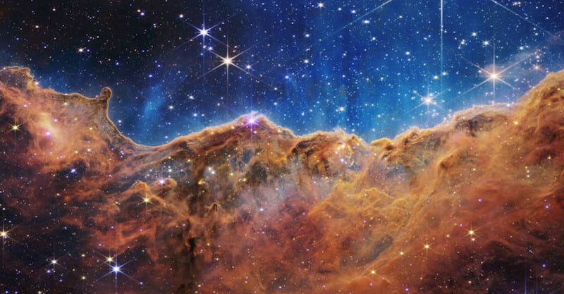 This image released by NASA on Tuesday, July 12, 2022, shows the edge of a nearby, young, star-forming region NGC 3324 in the Carina Nebula.