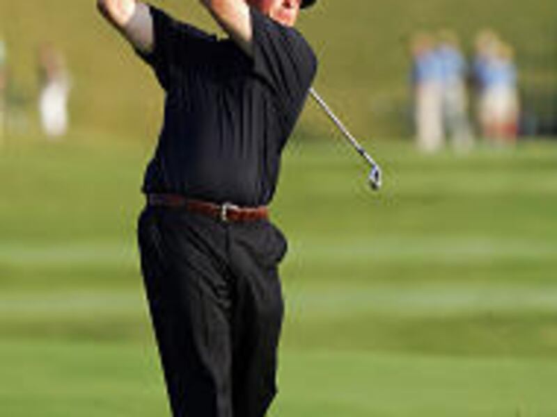 Phil Mickelson hits his second shot on the 18th hole Sunday.