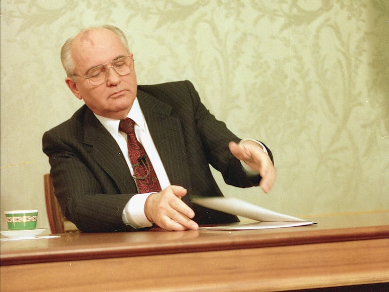 Mikhail Gorbachev, eighth and final leader of the Soviet Union, closes his resignation speech on the table after delivering it on Soviet television in the Kremlin, Moscow, Wednesday, Dec. 25, 1991.