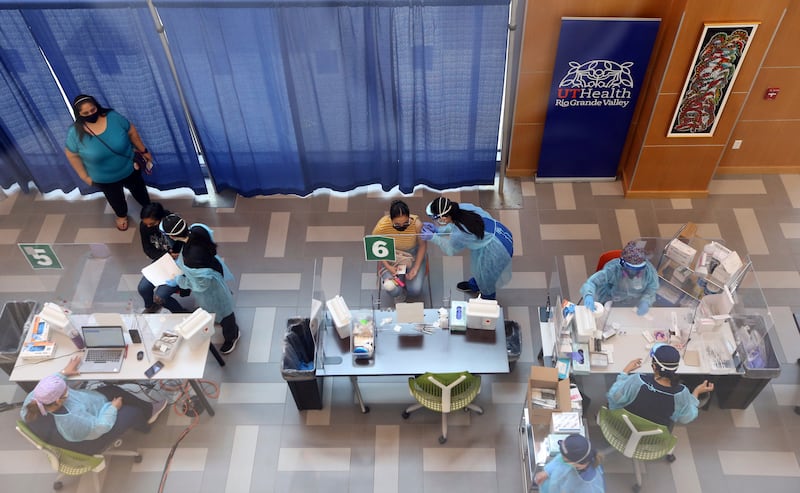 Texas-Rio Grande Valley’s medical students help during a COVID-19 vaccination event at the medical school on Thursday, April 8,2021, in Edinburg, Texas.