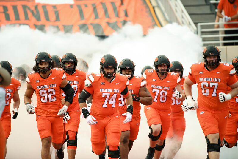 Oklahoma State players take the field prior to game, Sept. 16, 2023, in Stillwater. South Alabama shocked the Cowboys, 33-7.