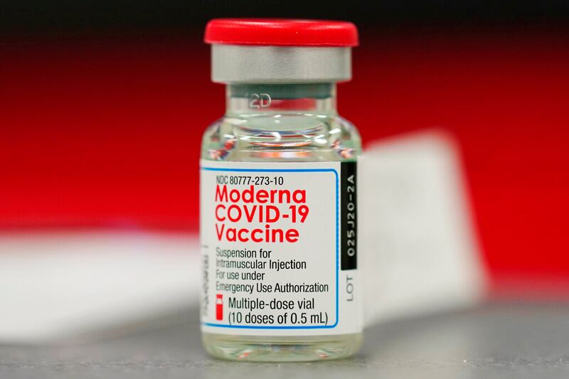A vial of the Moderna COVID-19 vaccine in Denver.