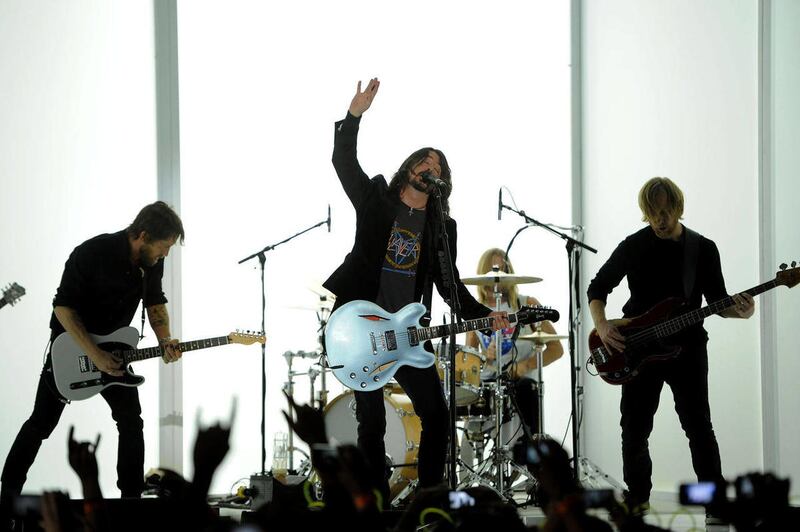 Dave Grohl, center, and the Foo Fighters performs at the 54th annual Grammy Awards in Los Angeles.