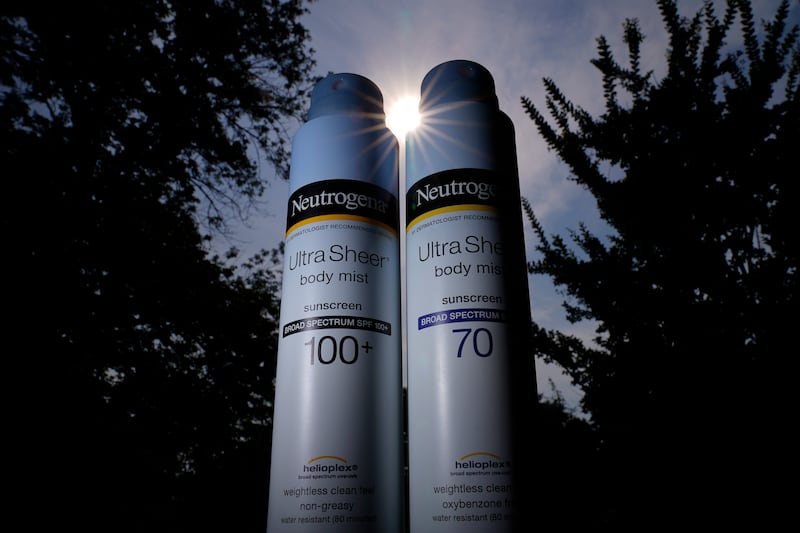 Cans of Neutrogena UltraSheer aerosol sunscreen.