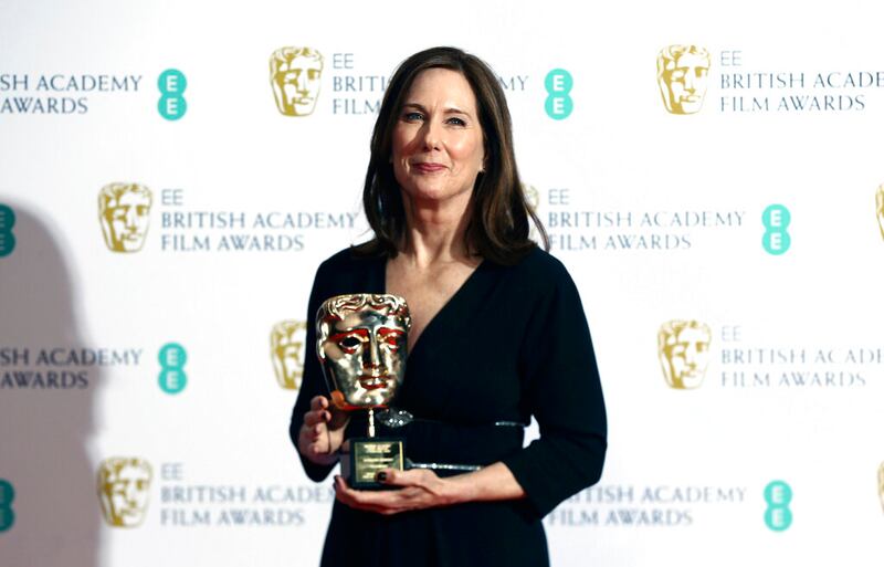 Kathleen Kennedy, winner of the BAFTA Fellowship, poses with her award.