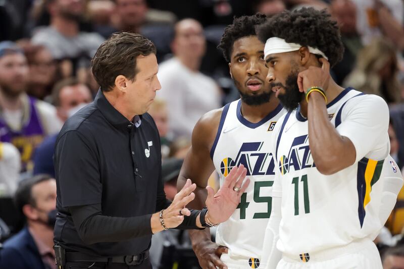 Utah Jazz coach Quin Snyder talks to guard Donovan Mitchell and guard Mike Conley during the game against the Denver Nuggets.